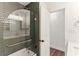 Stylish bathroom with green subway tile in shower/tub and gold accents at 3009 Jim Johnson Rd, Plant City, FL 33566