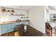Dining area with rustic wood table, custom built-in cabinetry, and stylish decor at 3009 Jim Johnson Rd, Plant City, FL 33566