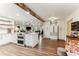 Spacious kitchen with stainless steel appliances, a large island, and a rustic wood beam accent at 3009 Jim Johnson Rd, Plant City, FL 33566