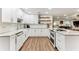 Modern kitchen with white cabinetry, granite countertops, and stainless steel appliances at 3009 Jim Johnson Rd, Plant City, FL 33566