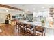 Open-concept kitchen featuring a large island with seating and granite countertops at 3009 Jim Johnson Rd, Plant City, FL 33566