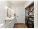 Well-organized laundry room features modern black washer and dryer and ample storage at 3009 Jim Johnson Rd, Plant City, FL 33566