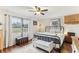 Comfortable bedroom with natural light, hardwood floors, and stylish furnishings at 3009 Jim Johnson Rd, Plant City, FL 33566