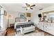 Bedroom with a walk in closet, a ceiling fan, and decorative furnishings at 3009 Jim Johnson Rd, Plant City, FL 33566