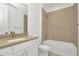 Modern bathroom with double sinks, white cabinetry, and shower at 8421 Golden Beach Ct, Parrish, FL 34219