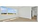 Bright bedroom featuring wood flooring and windows with an expansive view at 8421 Golden Beach Ct, Parrish, FL 34219