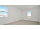 Bright bedroom with two windows letting in natural light and neutral carpeting at 8421 Golden Beach Ct, Parrish, FL 34219