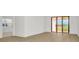 Large bedroom with sliding glass doors that lead to a balcony at 8421 Golden Beach Ct, Parrish, FL 34219