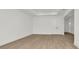 Light and airy room featuring wood floors, white walls and ceiling at 8421 Golden Beach Ct, Parrish, FL 34219