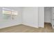 Bright bedroom with a large window and neutral decor at 8421 Golden Beach Ct, Parrish, FL 34219