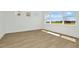 Bright bedroom with wood flooring and large windows overlooking the outdoors at 8421 Golden Beach Ct, Parrish, FL 34219