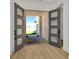 Inviting entryway featuring stylish double doors and elegant wood flooring at 8421 Golden Beach Ct, Parrish, FL 34219