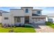 Stunning two-story home with a modern design and beautifully landscaped front yard at 8421 Golden Beach Ct, Parrish, FL 34219