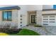 Beautiful home featuring stone accents, a two-car garage, and modern black-framed windows at 8421 Golden Beach Ct, Parrish, FL 34219
