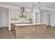 Modern kitchen featuring an island, white countertops, and stainless appliances at 8421 Golden Beach Ct, Parrish, FL 34219