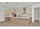 New kitchen boasts sleek countertops, island with pendant lights, and stainless appliances at 8421 Golden Beach Ct, Parrish, FL 34219