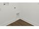 Laundry area with wood look floors and white walls at 8421 Golden Beach Ct, Parrish, FL 34219