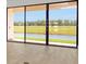 Living Room showcasing sliding glass doors to the back yard at 8421 Golden Beach Ct, Parrish, FL 34219