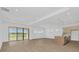 Bright living room with modern finishes and sliding glass doors to a beautiful view at 8421 Golden Beach Ct, Parrish, FL 34219