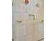 Close up of a modern tile shower with gold hardware and fixtures at 8421 Golden Beach Ct, Parrish, FL 34219