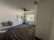 Bedroom needing repair with peeling paint, worn floors, and view of exterior at 14236 Palm St, Madeira Beach, FL 33708