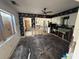 View of a partially demolished kitchen with black wallpaper and some remaining cabinets at 14236 Palm St, Madeira Beach, FL 33708
