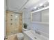 Bright bathroom with shower and tub combination featuring new fixtures, neutral paint and decor at 2424 W Tampa Bay Blvd # B201, Tampa, FL 33607