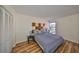 Cozy bedroom with modern decor, a comfortable bed, and a window providing natural light and a view of the outdoors at 2424 W Tampa Bay Blvd # B201, Tampa, FL 33607
