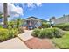 Charming clubhouse exterior surrounded by lush landscaping and a welcoming entrance at 2424 W Tampa Bay Blvd # B201, Tampa, FL 33607