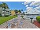 Common area with patio table, benches, grill, and pool access for outdoor enjoyment at 2424 W Tampa Bay Blvd # B201, Tampa, FL 33607