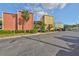 Exterior shot of colorful two-story condos with parking and manicured landscaping at 2424 W Tampa Bay Blvd # B201, Tampa, FL 33607