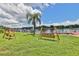 Community waterfront area with wooden swings, docks and lovely landscaping at 2424 W Tampa Bay Blvd # B201, Tampa, FL 33607