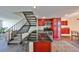 Modern kitchen featuring sleek countertops, stainless steel appliances, and stylish red cabinetry at 2424 W Tampa Bay Blvd # B201, Tampa, FL 33607