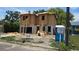 New two-story home under construction featuring block and wood framing and Mobley information sign at 1009 W Ohio Ave, Tampa, FL 33603