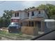 New home construction shows a modern, two-story home in progress with a blue truck in front at 1009 W Ohio Ave, Tampa, FL 33603