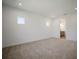 Spacious, carpeted bedroom with two windows and an ensuite bathroom at 11892 Richmond Trl, Parrish, FL 34219