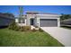 Charming single-Gathering home with a manicured lawn, stone accents, and a two-car garage at 11892 Richmond Trl, Parrish, FL 34219