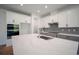 Gourmet kitchen featuring a large island, built-in oven, and ample counter space at 11892 Richmond Trl, Parrish, FL 34219