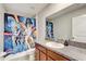 Themed bathroom with shower tub combo and granite vanity top at 13456 Marble Sands Ct, Hudson, FL 34669
