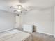 Spacious bedroom with soft carpeting, ceiling fan, and closet access at 13456 Marble Sands Ct, Hudson, FL 34669
