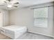 Bright bedroom with large window and neutral carpet at 13456 Marble Sands Ct, Hudson, FL 34669