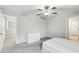 Carpeted bedroom with ceiling fan and adjacent closet at 13456 Marble Sands Ct, Hudson, FL 34669