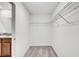Walk-in closet featuring wire shelving and doorway to sink at 13456 Marble Sands Ct, Hudson, FL 34669
