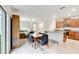 Open kitchen and dining area featuring granite countertops and stainless steel appliances at 13456 Marble Sands Ct, Hudson, FL 34669