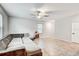 Comfortable living area with large sectional, tiled floor, and natural light creating a relaxing space at 13456 Marble Sands Ct, Hudson, FL 34669