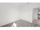 Bright bedroom with carpeted floors adjacent to the bathroom at 1975 Pepper Grass Dr, North Port, FL 34289