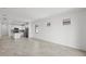 Open-concept living room with tile floors and recessed lighting throughout at 1975 Pepper Grass Dr, North Port, FL 34289