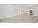 Spacious living area with tile floors, connecting to the kitchen at 1975 Pepper Grass Dr, North Port, FL 34289