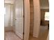 Bathroom showcasing a shower/tub and an organized closet with white wire shelving at 35324 Whispering Pines Dr, Zephyrhills, FL 33541