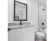 Bathroom featuring a white vanity, granite countertops and black hardware at 4743 Michaler St, North Port, FL 34286